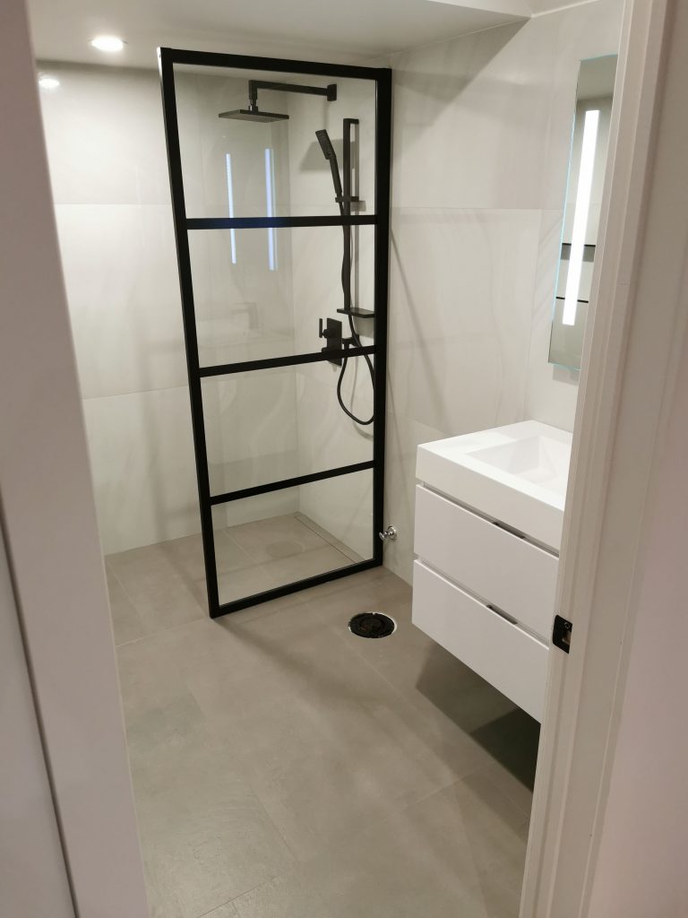 Small bathroom walk-in shower layout that opens up the space
